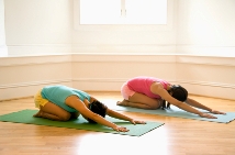 Two sisters in Yoga Child's Pose